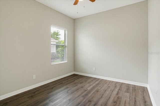 empty room featuring ceiling fan and hardwood / wood-style flooring