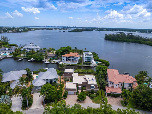 birds eye view of property featuring a water view and a residential view