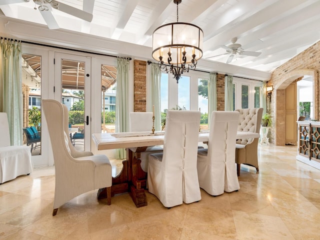 dining space featuring a wealth of natural light, beamed ceiling, and ceiling fan with notable chandelier