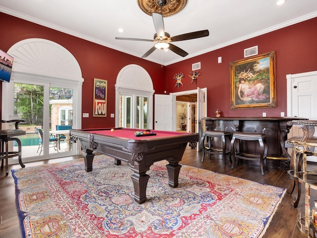 playroom featuring bar, ornamental molding, dark hardwood / wood-style floors, and pool table