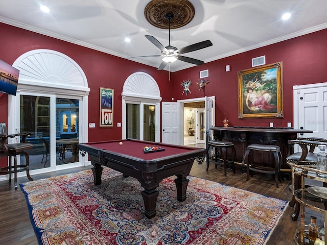 game room featuring bar, crown molding, dark hardwood / wood-style floors, and pool table