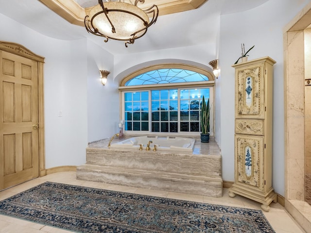 bathroom with tile patterned floors and tiled tub