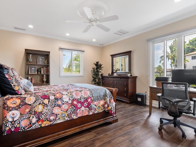 bedroom with dark hardwood / wood-style flooring, ceiling fan, and ornamental molding