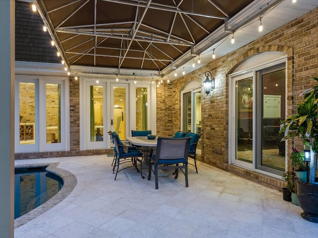 view of patio featuring a swimming pool and french doors