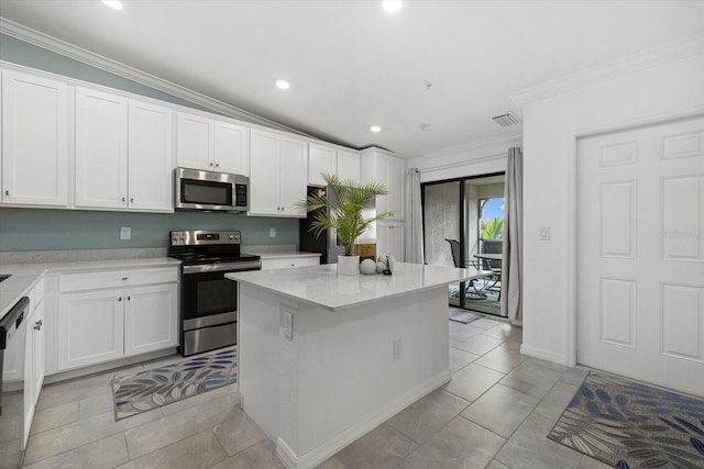 kitchen with white cabinetry, light stone countertops, vaulted ceiling, and stainless steel appliances