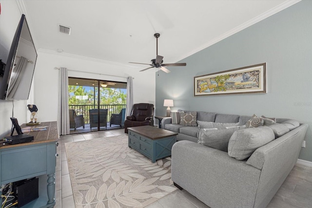 living room with ceiling fan, lofted ceiling, ornamental molding, and light tile patterned floors