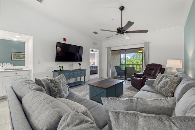 tiled living room with crown molding, ceiling fan, and vaulted ceiling