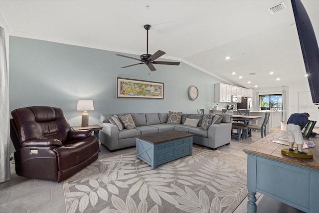 tiled living room featuring crown molding, ceiling fan, and lofted ceiling