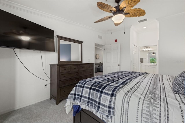 carpeted bedroom featuring ornamental molding, connected bathroom, and ceiling fan