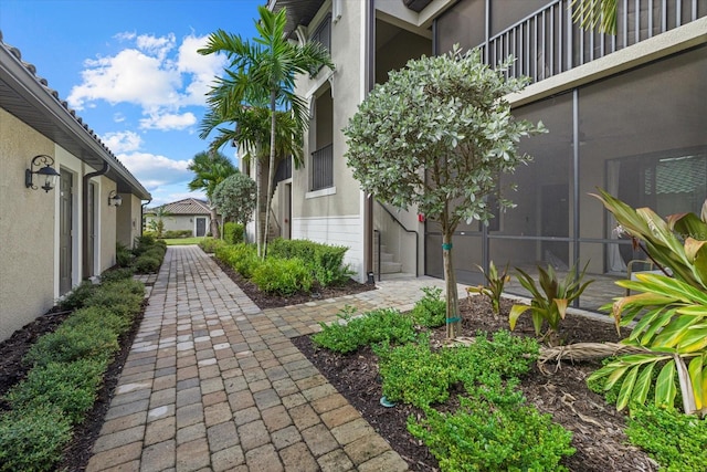 view of property's community with a garage