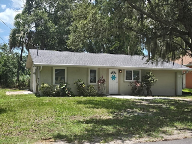 ranch-style house featuring a front lawn