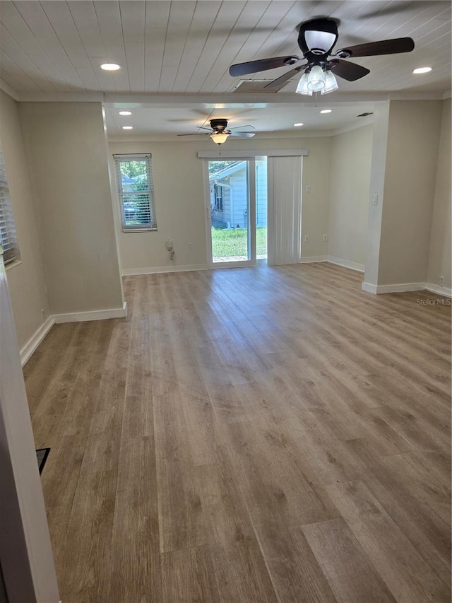 unfurnished room with ceiling fan, hardwood / wood-style floors, and ornamental molding