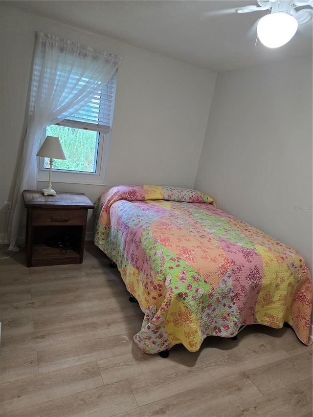 bedroom featuring ceiling fan and light wood-type flooring