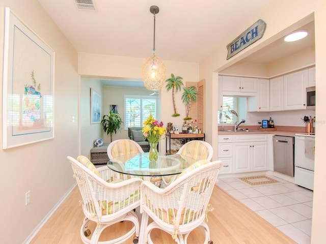 tiled dining space with sink