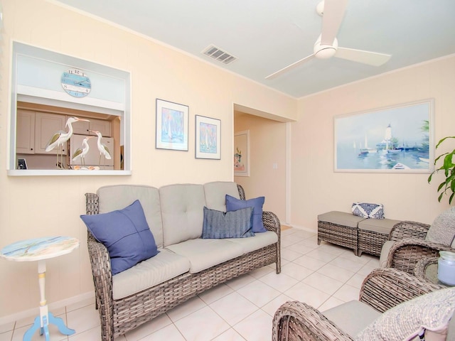 tiled living room with ceiling fan