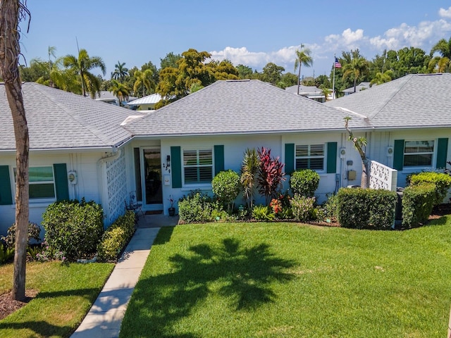 single story home featuring a front yard