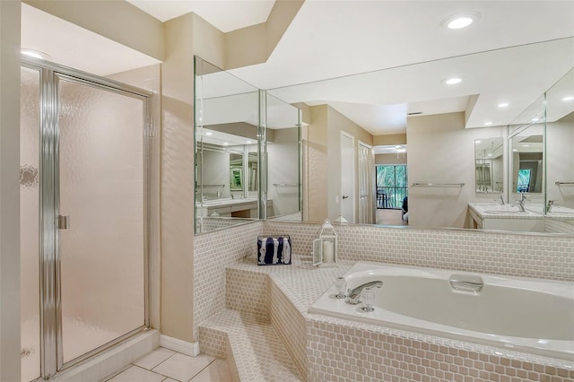 bathroom featuring separate shower and tub, tile patterned floors, and vanity