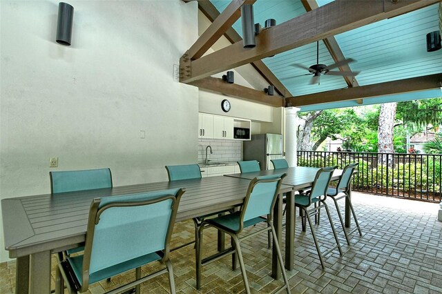 view of patio / terrace featuring sink and ceiling fan