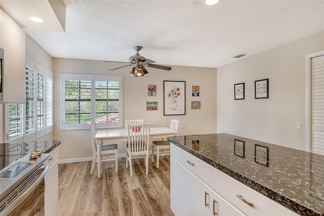 7673 Fairway Woods Dr Unit 706, Sarasota, FL 34238 - dining area with recessed lighting, a textured ceiling, light wood finished floors, ceiling fan, and visible vents