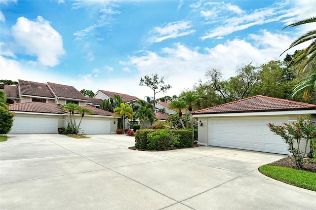 7673 Fairway Woods Dr Unit 706, Sarasota, FL 34238 - view of front of home featuring a tiled roof and stucco siding