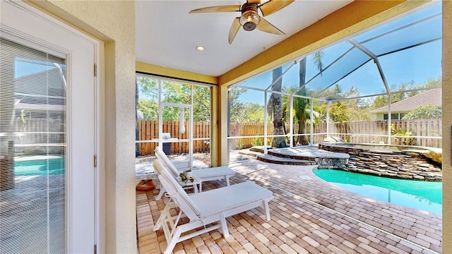 view of pool featuring ceiling fan