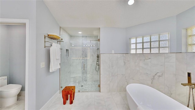 bathroom featuring tile walls, toilet, independent shower and bath, and a textured ceiling