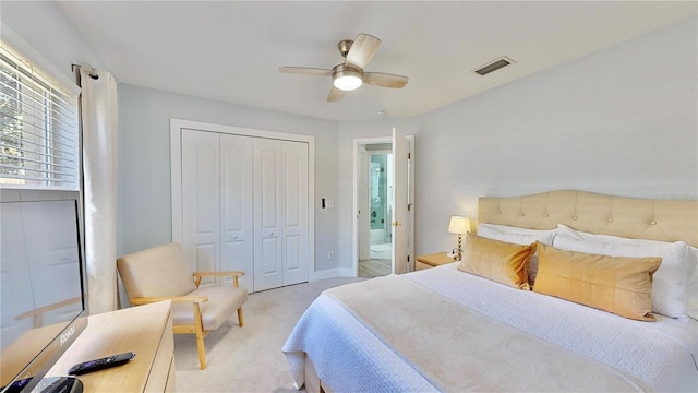 bedroom with light carpet, a closet, and ceiling fan