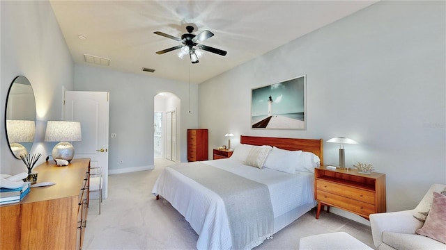 carpeted bedroom featuring lofted ceiling, ceiling fan, and ensuite bathroom