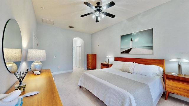 carpeted bedroom with lofted ceiling, a closet, and ceiling fan