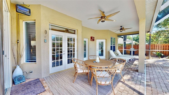 deck featuring french doors, ceiling fan, and a patio area