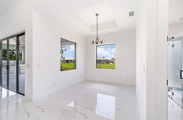 dining room featuring marble finish floor, a tray ceiling, visible vents, and baseboards