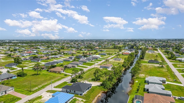 aerial view featuring a water view and a residential view