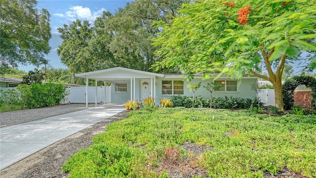 single story home featuring a carport