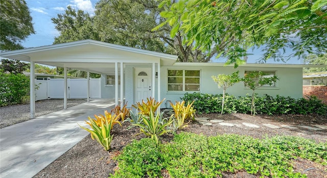 view of front of property featuring a carport