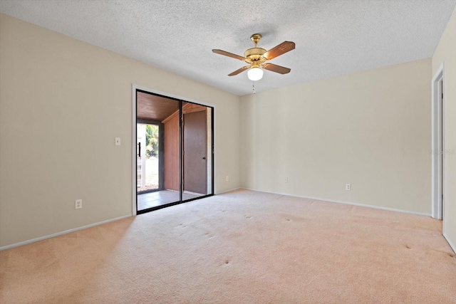 spare room with light carpet, a textured ceiling, and ceiling fan