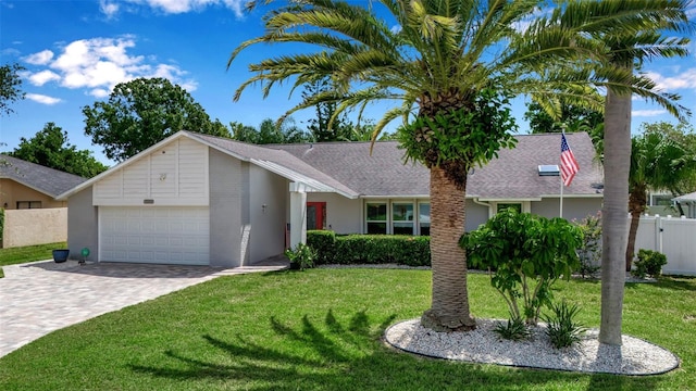 single story home with a garage and a front yard