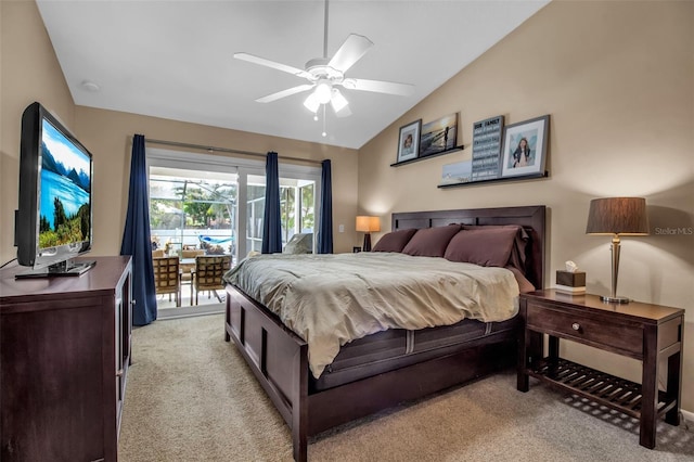 carpeted bedroom featuring ceiling fan, vaulted ceiling, and access to outside