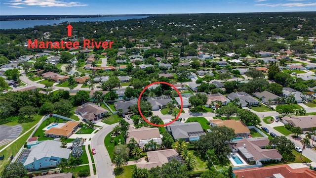 birds eye view of property featuring a water view