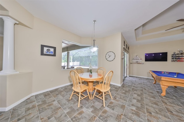 dining space featuring decorative columns and pool table