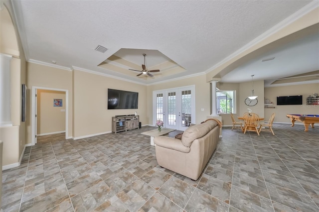 living room featuring ceiling fan, french doors, billiards, decorative columns, and ornamental molding