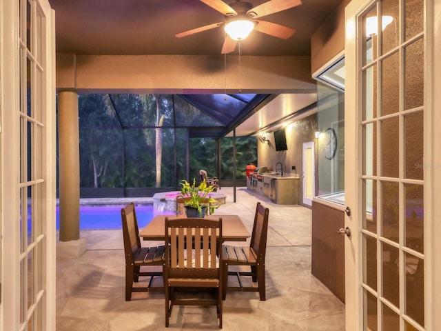 sunroom with french doors and ceiling fan