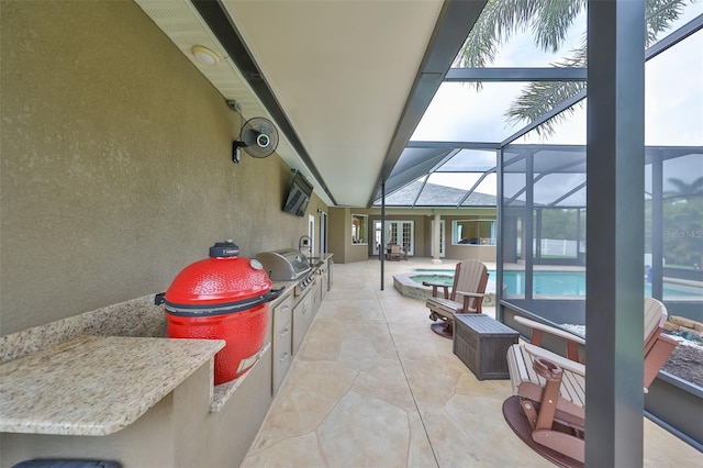 view of patio / terrace featuring glass enclosure, grilling area, and a pool with connected hot tub