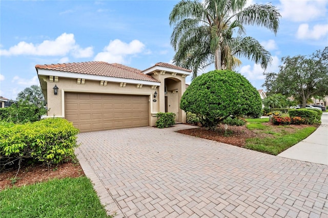 mediterranean / spanish-style home featuring a garage