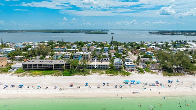 drone / aerial view with a beach view and a water view