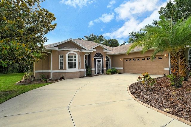 ranch-style home featuring a garage