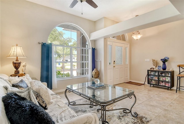 tiled living room featuring ceiling fan