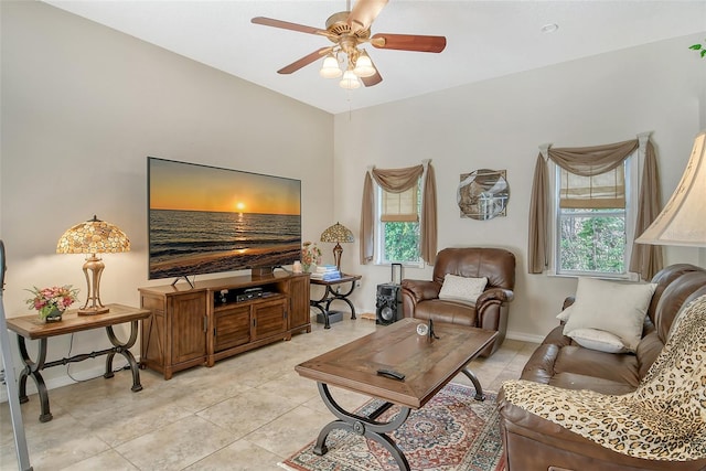 tiled living room featuring ceiling fan and plenty of natural light