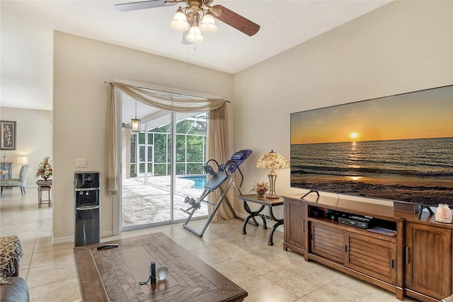 living room featuring ceiling fan and light tile patterned floors