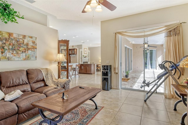 tiled living room featuring a textured ceiling and ceiling fan