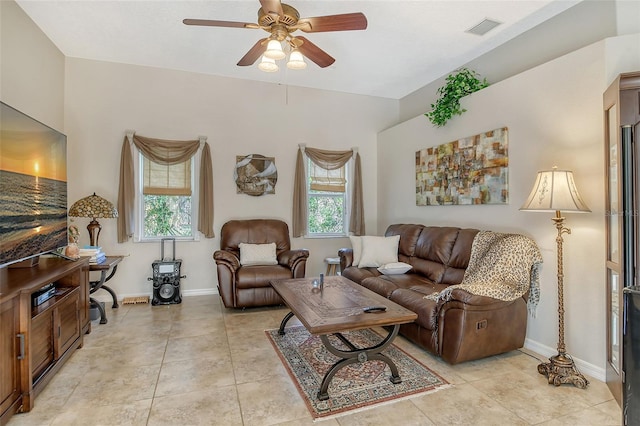 living room with light tile patterned floors, a healthy amount of sunlight, and ceiling fan